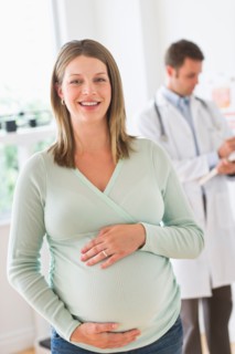 Young woman with doctor in doctor's office.