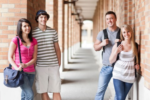 Portrait of four college students in corridor. Photo: Take A Pix Media