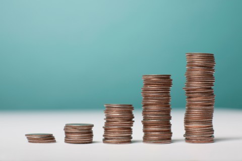 Studio shot of stacks of coins. Photo : Winslow Productions