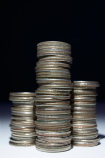 Studio shot of stacks of coins. Photo : Winslow Productions