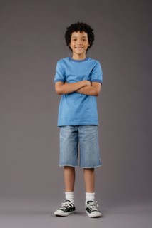 Portrait of smiling boy (8-9), studio shot. Photo : Rob Lewine