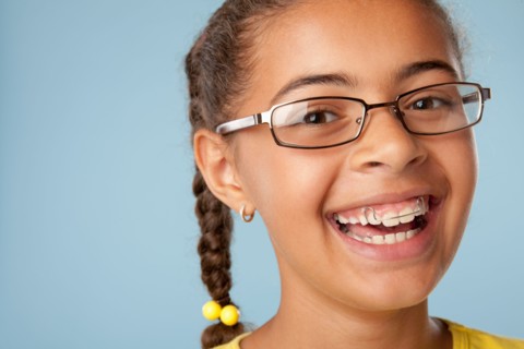 Studio portrait of girl laughing (10-11). Photo : Rob Lewine