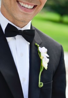 Close-up of smiling groom.