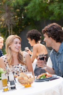 Couple dining in outdoor restaurant. Photo : Rob Lewine