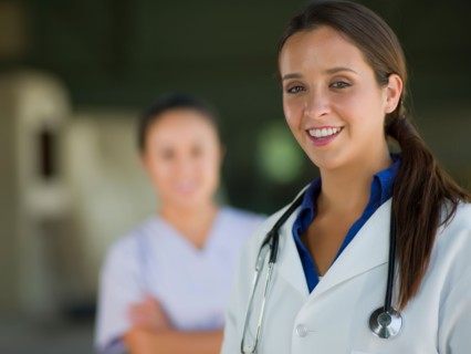 Portrait of female doctor, healthcare worker in background. Photo : db2stock