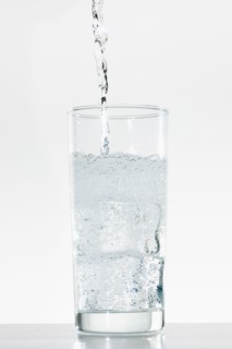 Studio shot of water being poured into glass.