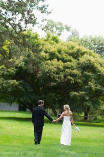 Newly wed couple walking together.