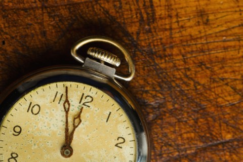 Old-fashioned pocket watch, studio shot.