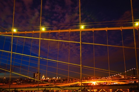 USA, New York State, New York City, Midtown Manhattan and Brooklyn Bridge at night.