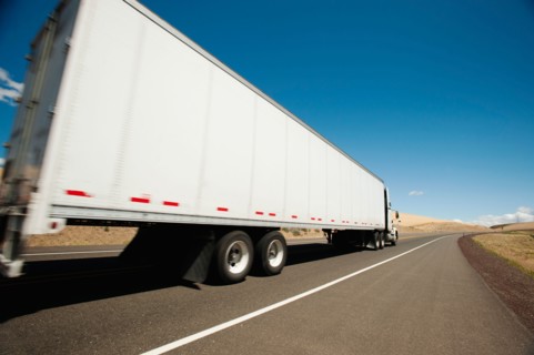 USA, Oregon, Wasco, Lorry travelling through rural landscape.
