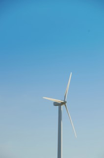 Turkey, Cesme, wind turbine against blue sky. Photo : Tetra Images
