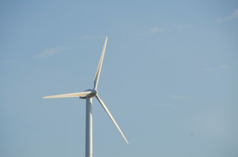 Turkey, Izmir, wind turbine against blue sky. Photo : Tetra Images