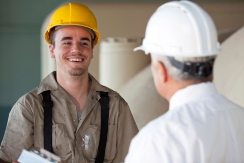 Manual worker and manager. Photo : db2stock