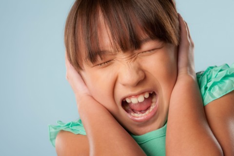 Studio shot of girl (10-11) shouting. Photo : Rob Lewine