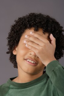 Portrait of surprised boy (8-9), studio shot. Photo : Rob Lewine