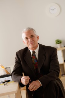 Portrait of smiling senior businessman. Photo : Rob Lewine