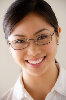 Portrait of young smiling businesswoman. Photo : Rob Lewine