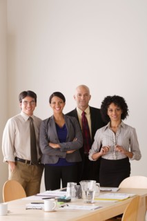 Portrait of business team in board room. Photo : Rob Lewine