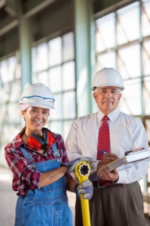 Portrait of manual worker and manager. Photo : db2stock