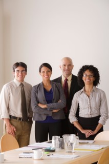 Portrait of business team in board room. Photo : Rob Lewine