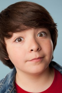 Studio portrait of boy (10-11) staring at camera. Photo: Rob Lewine