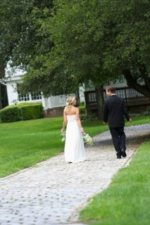 Newly wed couple walking together.