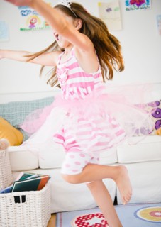 Girl ( 6-7) dancing in her room. Photo : Jamie Grill