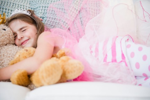 Girl ( 6-7) sleeping in costume and crown. Photo : Jamie Grill