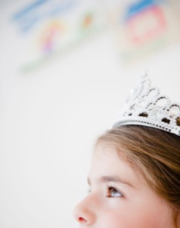 Close up of girl's head ( 6-7) with crown. Photo : Jamie Grill
