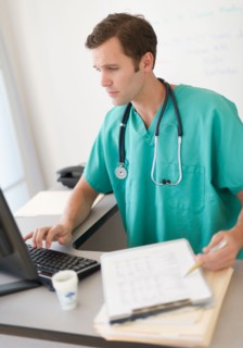Doctor using computer.
