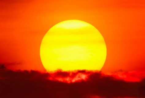Large sun at sunset.