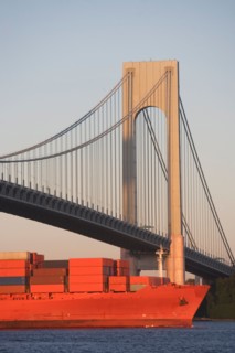 USA, New York State, New York City, Brooklyn, Container Ship under Verrazano-Narrows Bridge. Photo