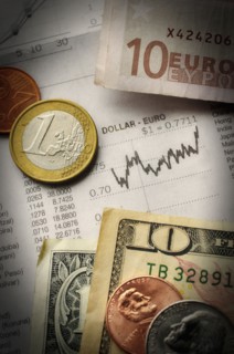 Euro and dollars with financial graph, studio shot.