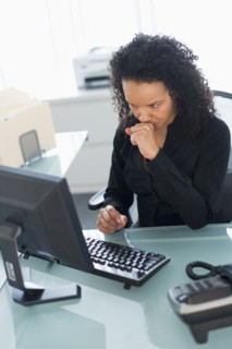 Business woman using computer.
