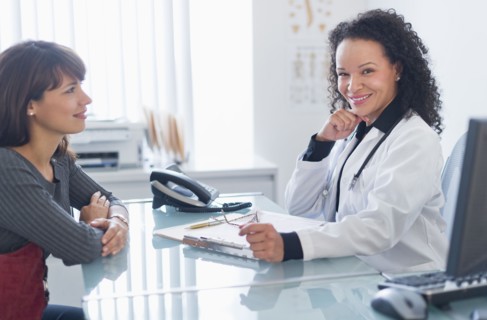 Doctor with patient in office.