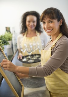 Two female business owners in restaurant.