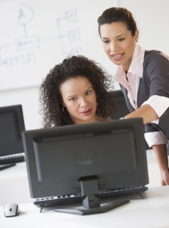 Business women using computer in office.