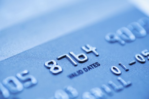 Detail of credit card, studio shot.
