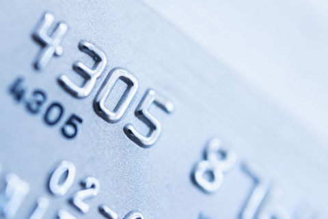 Detail of credit card, studio shot.