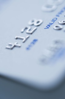 Detail of credit card, studio shot.