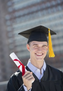 Teenage boy (16-17) at his graduation ceremony.