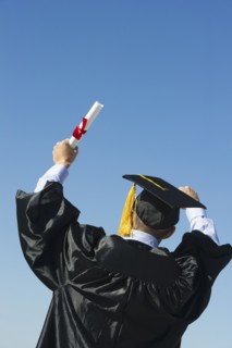 Teenage boy (16-17) at his graduation ceremony.