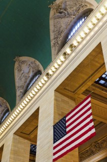 USA, New York State, New York City, Interior of Grand Central Station with American flag.
