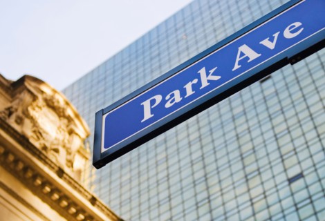 USA, New York State, New York City, Park Avenue road sign with Grand Central Station in background.
