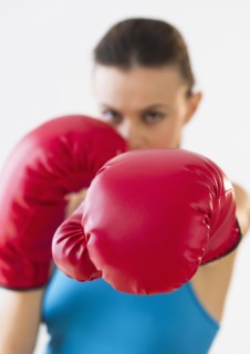 Studio shot of woman boxing.