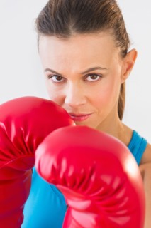 Studio shot of woman boxing.