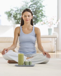 Woman meditating at home.