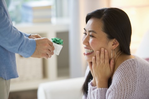 Man giving to woman engagement ring.