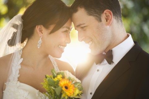 Bride and groom looking at each other.