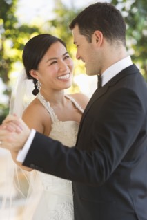 Bride and groom dancing.